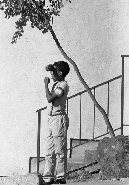 Oakland Boy, 1986 Boy Looking for Shade